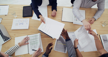 Above, meeting and hands of business people with documents for planning finance review or strategy....