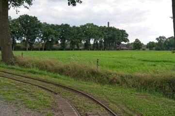 Narrow gauge rails for transporting clay to brick factory De Werklust which is in the background