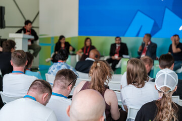 Panel discussion with attendees focused on business and innovation at a technology event.