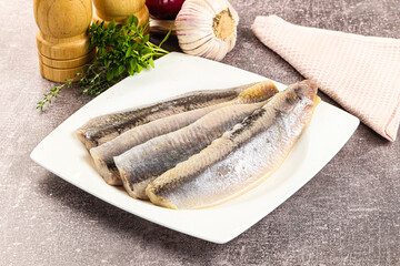 Marinated salted herring fillet apetizer