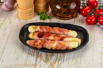 Hot mozzarella sticks with bacon
