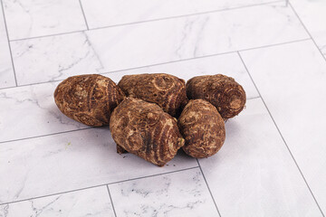 Brown topinambur roots for cooking