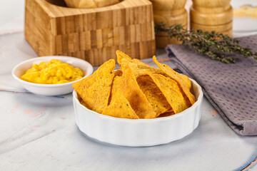 Corn nachos chips with cheese dip