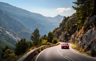Red car drive on mountain highway