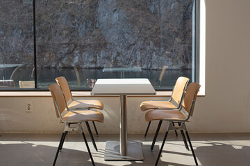 Table and chairs by the window.