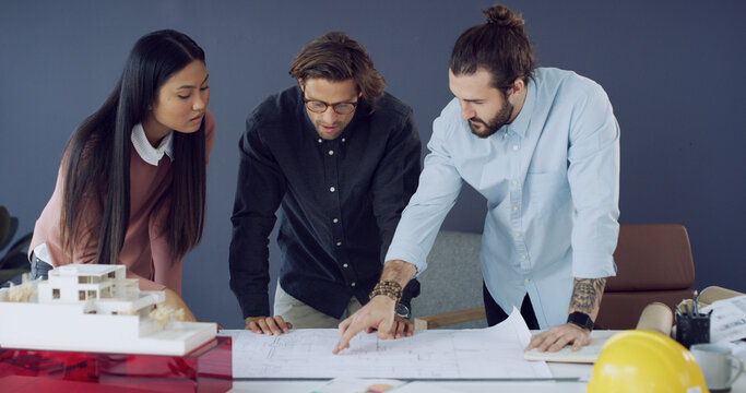 Architecture, blueprint or teamwork in meeting for building review, real estate construction project. Engineers, prototype design or people with floor plan for development, talking or property model