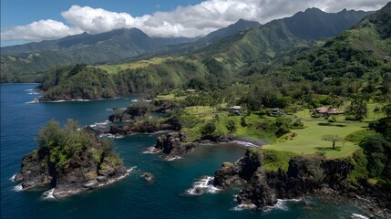 Panoramic view of a tropical coastline with lush vegetation and dark volcanic rock formations.