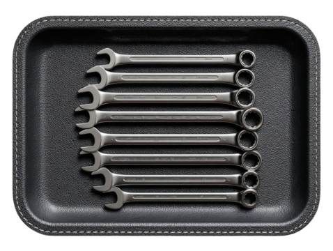 Metal wrenches in a dark gray tray