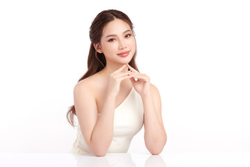 A beautiful young Asian woman with clean, fresh skin against a white background. Skincare, facial...