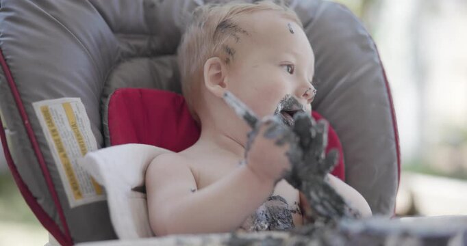 Strawberry Blonde Baby Eating Cake for the First Time
