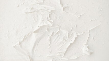 Closeup of peeling painted wall. peeling white paint on the wall. Texture of old rough coating. A wall with an unusual, abstract pattern