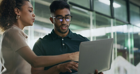 Laptop, meeting and web developers in office with troubleshooting online problem. Computer,...