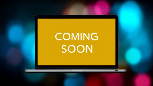Laptop screen displaying vibrant yellow background with bold text 'COMING SOON', surrounded by colorful bokeh lights, creating an engaging visual anticipation for upcoming content release