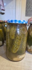 pickled cucumbers in glass jar