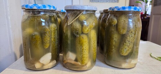 pickled cucumbers in glass jar