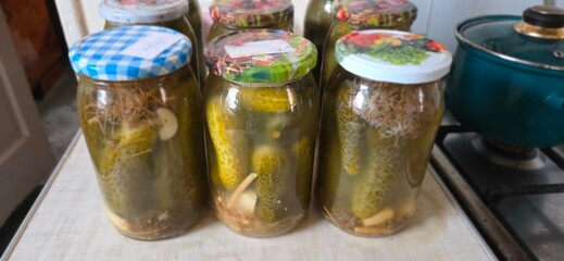 pickled cucumbers in glass jar