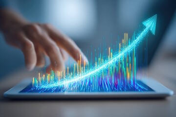 Hand interacting with a tablet displaying upward trending data visualizations