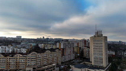 Aerial view of residential district with high-rise buildings under cloudy sky