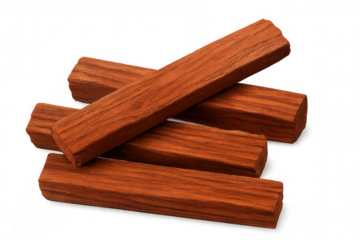 Sandalwood incense sticks resting on clear surface, highlighting natural wood grain for meditation, ritual, craft purposes