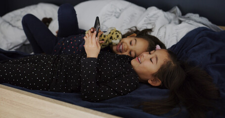 Relax, siblings and phone with kids in bed for streaming, education games and bonding. Learning...