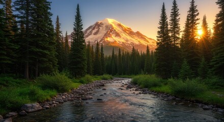 Majestic mountain peak bathed in golden sunrise light seen through a lush forest and stream