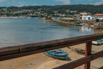 Small boats on the shore at the fishing village of Aldán, Galicia