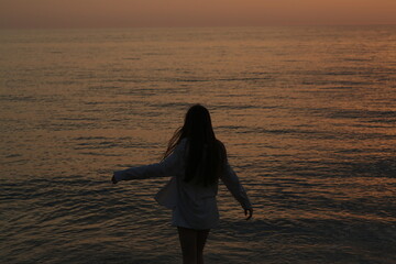 girl on the beach at sunset