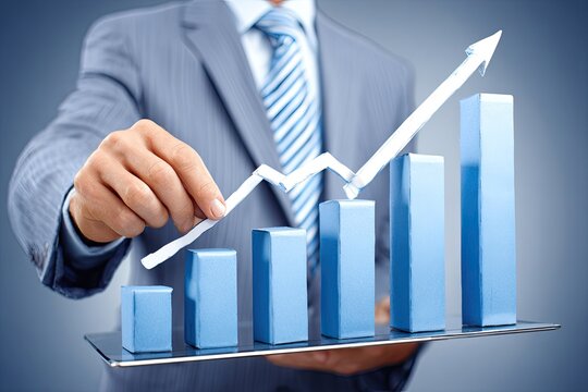 Businessman manipulating a 3D graph on a tablet showing increasing growth