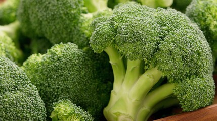 Fresh Green Broccoli Displayed on Wooden Plate for Healthy Eating and Cooking Purposes, Capturing Nutrition and Organic Lifestyle Choice