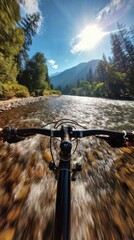 Control of a classic mountain bike filmed from the driver's point of view, the bike rushes at great speed on a wet road along a river, forest and mountains around
