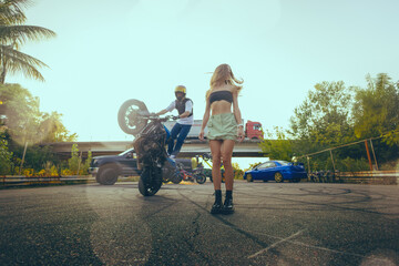 Moto stunt riding show on street.