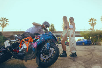 Moto stunt riding show on street.