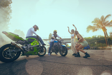 Moto stunt riding show on street.