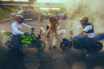Moto stunt riding show on street.