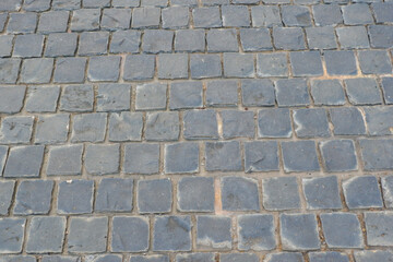 Paving stones on floor in parking lot,Concept of laying paving slabs and pavers,Textured concrete for gray floors,Concrete pavement blocks,space for text.