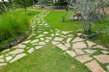 Garden landscape design with pathway in garden and footpath in picturesque summer park and...