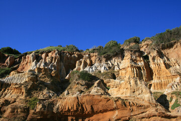Fototapeta premium Colorful Layered Cliffside and Blue Sky