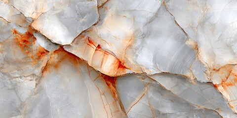 Detailed close-up view of a stone surface with variegated light gray, off-white, and orange hues, exhibiting a fractured, crystalline texture