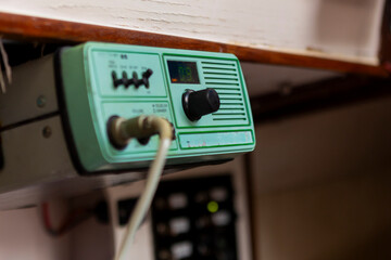 Vintage marine radio transmitter broadcasting on a sailboat