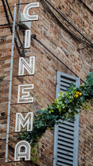 cine signboard in urbino in italy