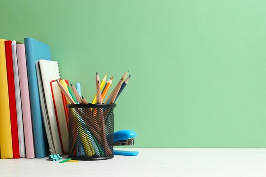 Back to school. Close-up of colorful stationery and textbooks on the desk