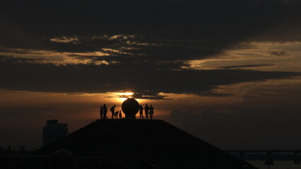silhouette of a people on sunset background