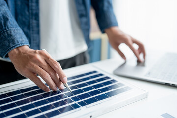 Businessman and Engineers Working on Solar Panels Project for Green Energy Accumulation in Eco-Friendly Office.