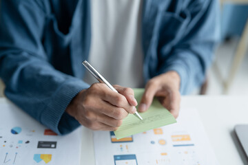 UX UI Designer Planning innovative Mobile App with Paper Wireframe Designs at Workspace.