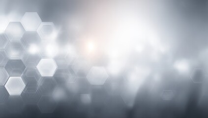Abstract background of hexagonal shapes in soft grey tones, with a blurred, glowing effect