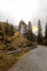 Surreal Mountain Path with Yellow Sun