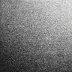 Textured metallic surface with subtle variations in light and shadow, ideal for backgrounds