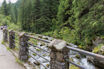 Stone Railing by a Mountain River