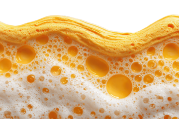Close-up of a textured layer of yellow and white foamy bubbles