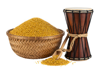 Traditional Indian yellow split pigeon peas in a woven basket and a dhol drum for cultural music